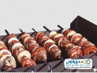 تصویر دوربری سیخ های کباب چنجه روی منقل